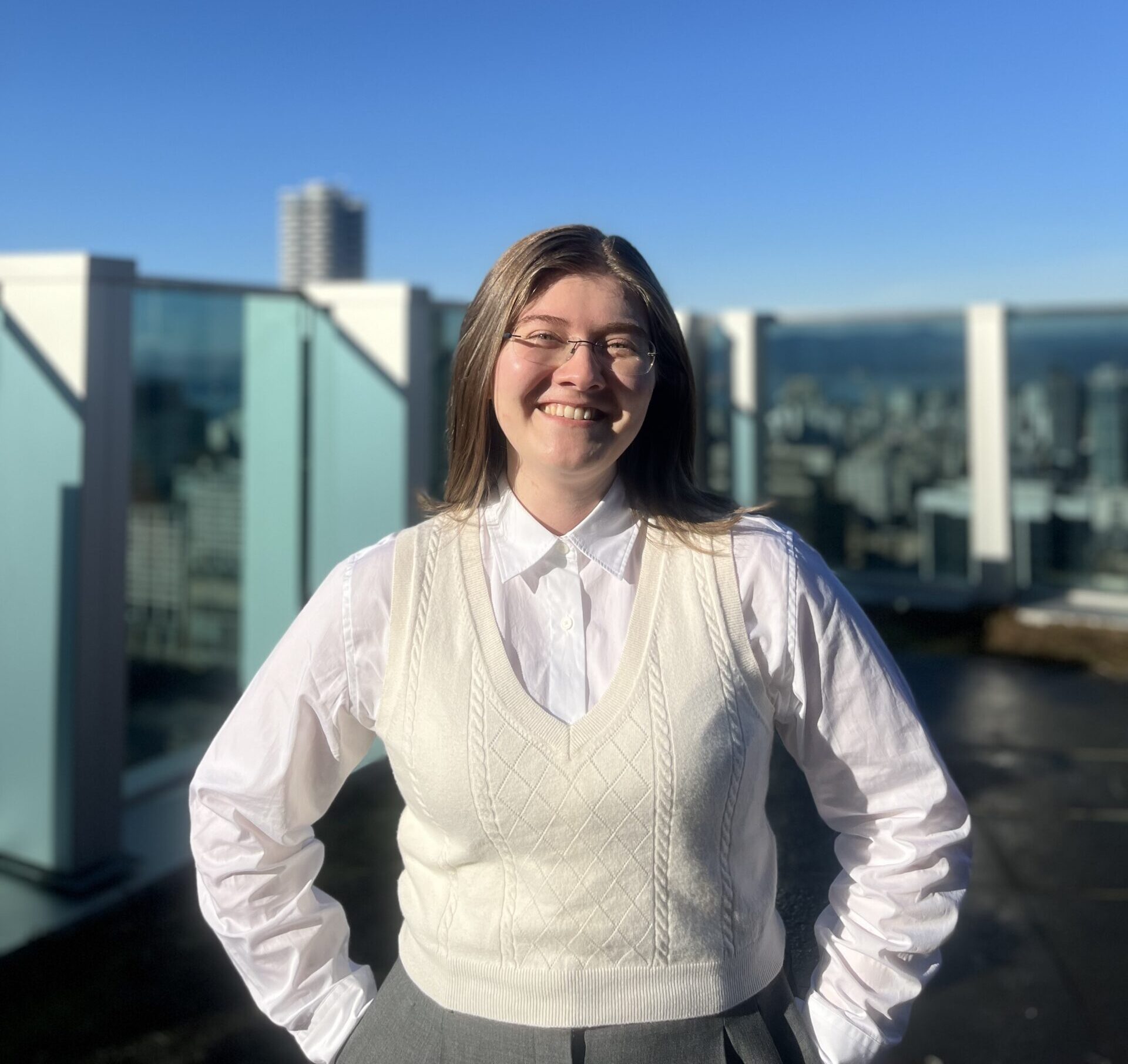 Woman standing with city behind
