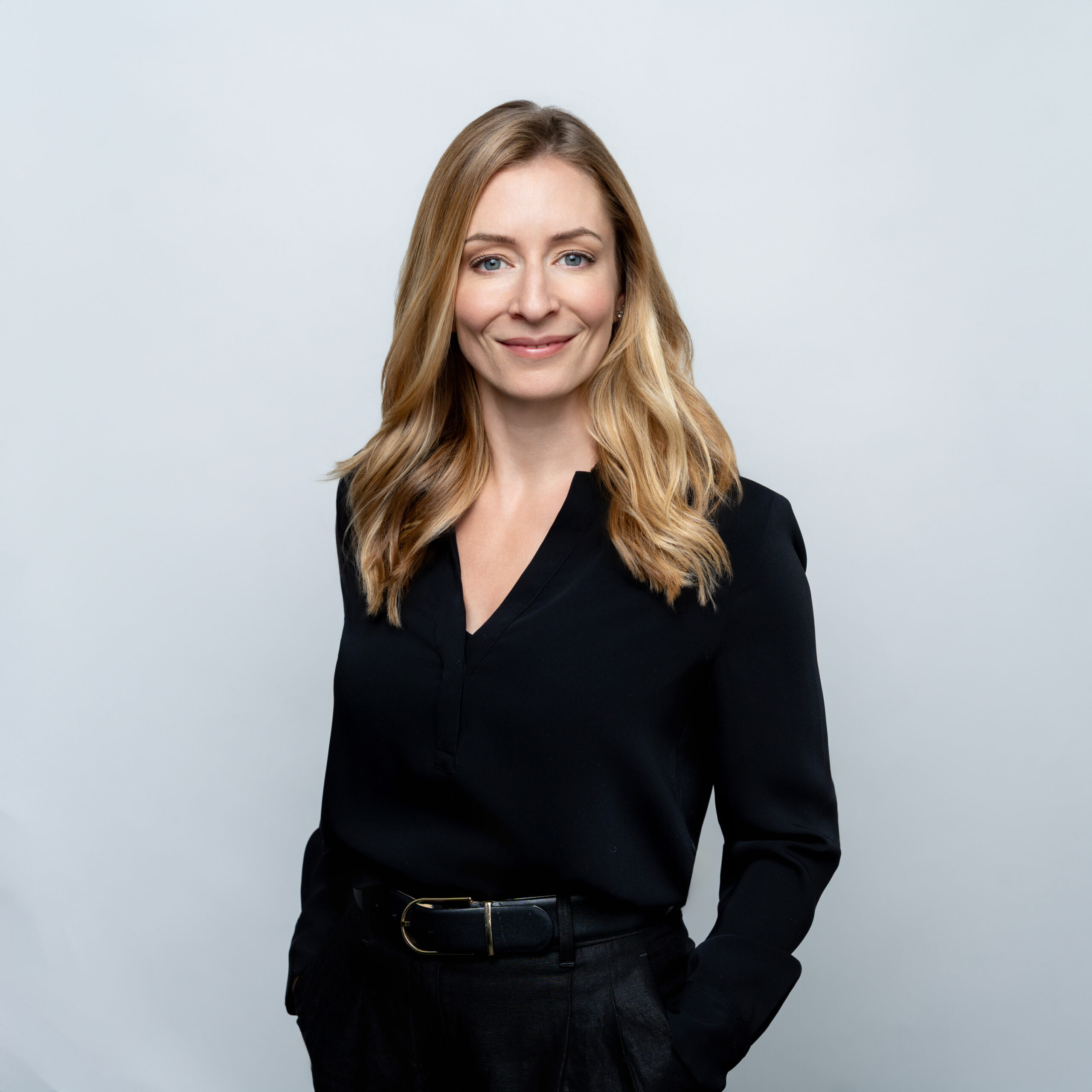 Woman standing in front of white background